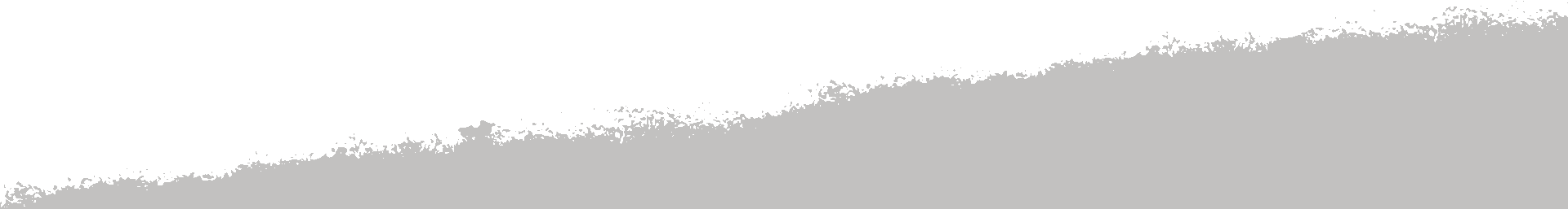 A horizontal gray and white abstract image with a jagged, uneven boundary running diagonally upward from left to right, creating a textured transition between the two colors.